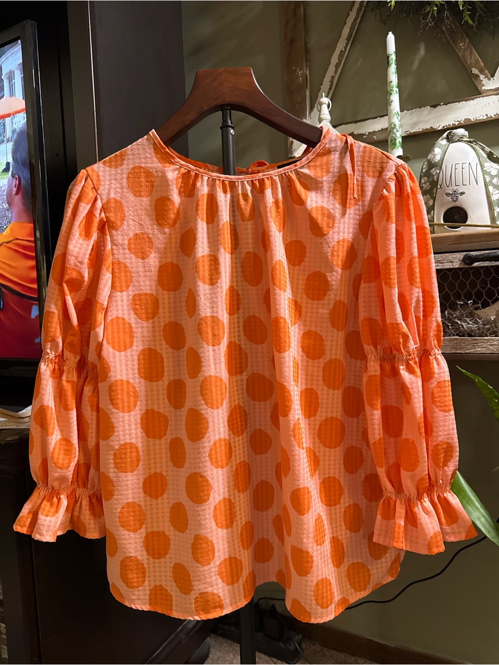 Pink blouse with orange polka dots